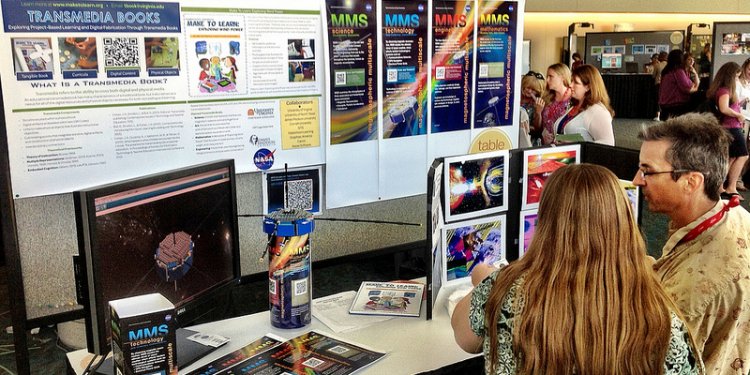 Teachers at ISTE 2012 enjoy the NASA MMS / ISTE Cyber Cafe poster session!